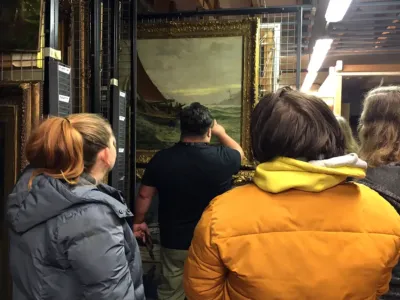 A group of people choosing artwork for Connections at the Art Gallery and Museum.